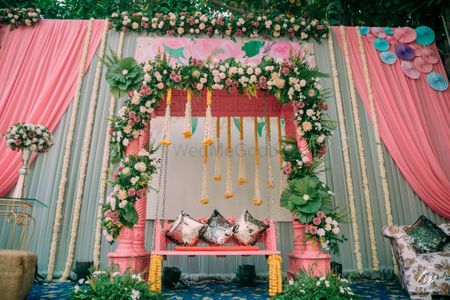 Photo of floral mehendi decor for bridal seat