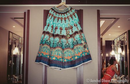 Photo of Teal and turquoise lehenga for sangeet on hanger