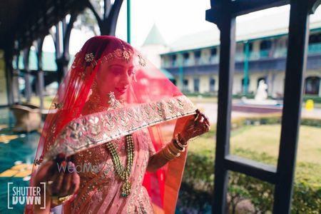 Bridal portrait with dupatta as veil