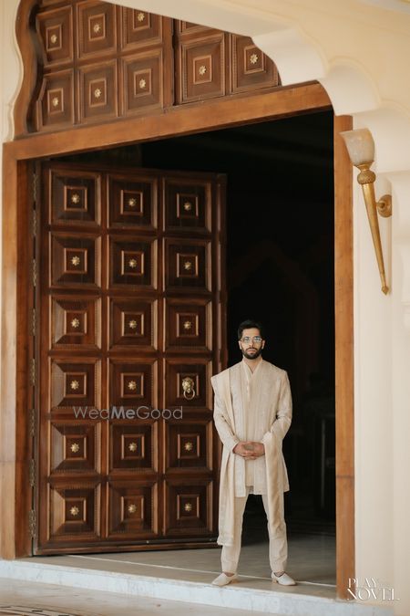 Classic groom portrait in a pastel sherwani on his wedding day 
