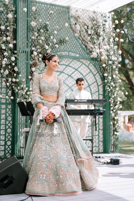 Gorgeous seafoam pastel lehenga with bride in a double sispatti look