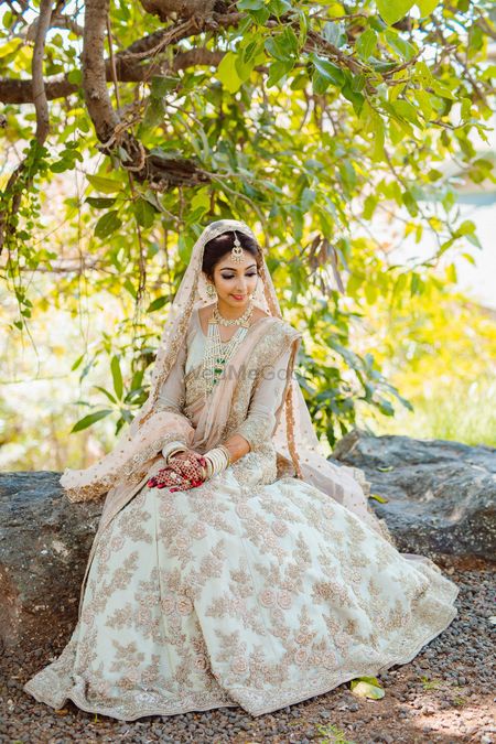 Photo of Pretty white and golden bridal lehenga for wedding