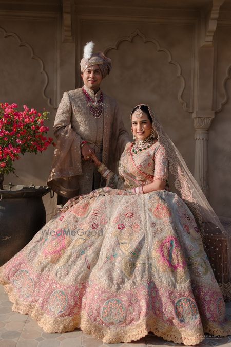 Lovely couple shot with the bride and groom in gorgeous pastel outfits