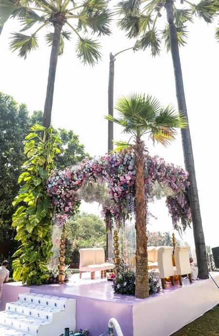 Mandap top decorated with blue, pink and purple flowers