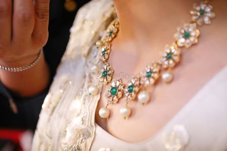 Simple bridal necklace with diamonds and emeralds