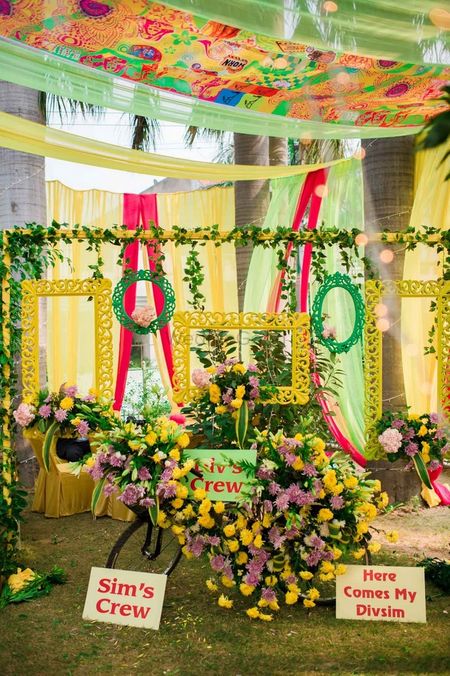 Yellow and green photobooth with frames
