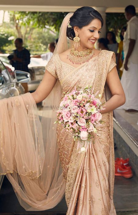 A christian bride in gold saree