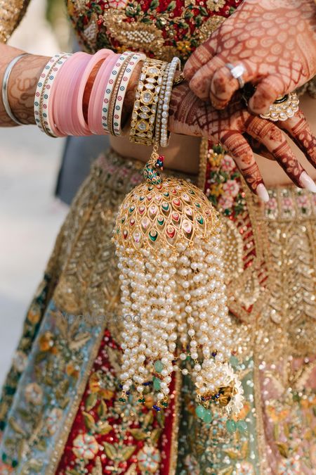 Photo of Peacock motif and pearl statement kaleeras for the bride on the wedding day