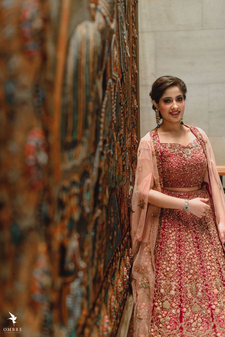 A bride to be in a shimmer lehenga for her engagement ceremony