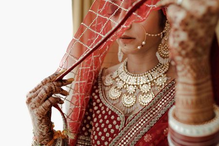A beautiful veil shot focussing on bridal jewellery 
