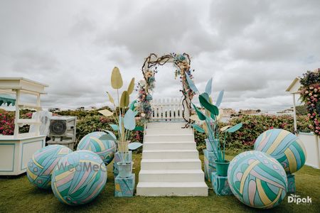 Photo of Aqua blue decor balls with floral elements for stage decor