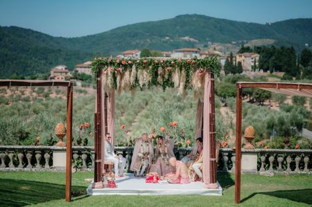 Photo of destination wedding mandap decor against the hills