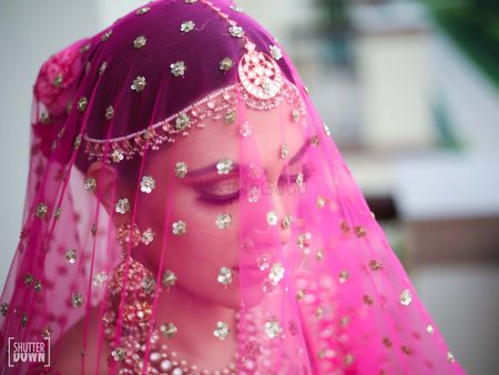Photo of pretty veil shot on wedding day