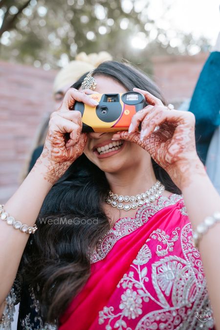 Photo of Disposable cameras for guests to capture candid shots at the wedding