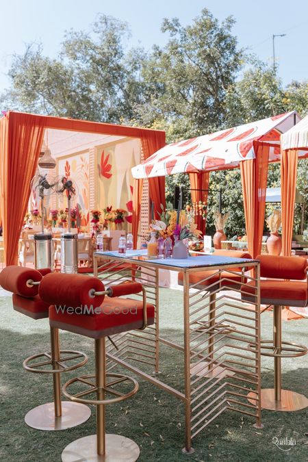 Photo of Carnival theme mehendi decor in orange and white colour scheme