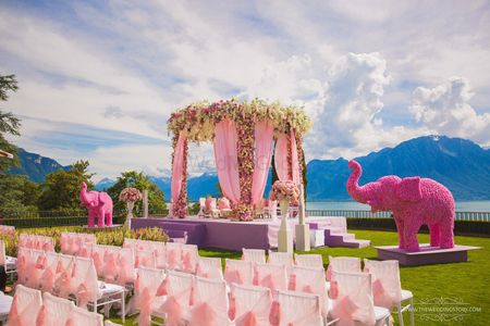 Photo of Light pink floral mandap with floral elephant