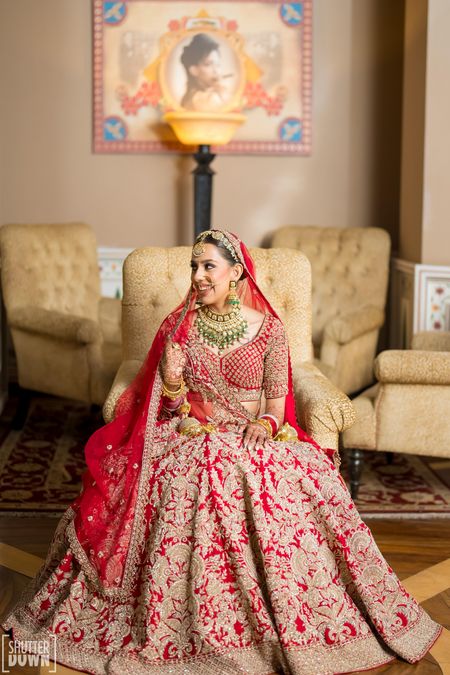 Red bridal lehenga by Sabyasachi Mukherjee