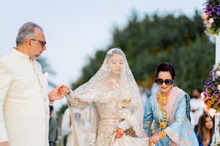 bride entering the nikah ceremony with her parents