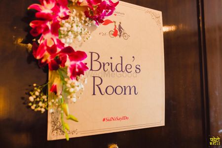 Photo of Bride's Room Personalised Card on Door with Flowers