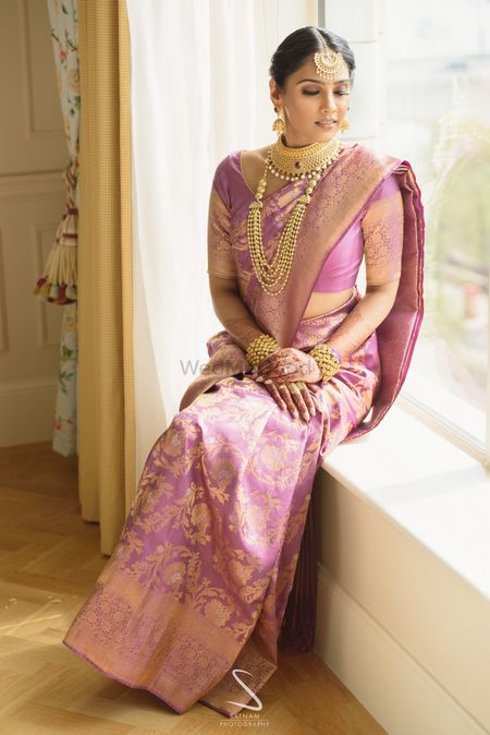 pretty unique bridal saree in light pink and gold