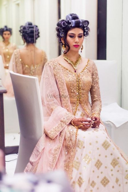 Photo of gold and white anarkali with blush pink dupatta for engagement event