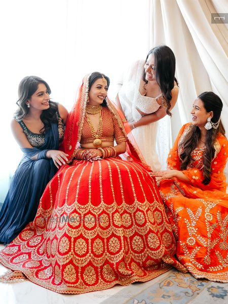 Candid capture of the bride with her bridesmaids on the wedding day