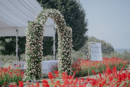 floral arches with intertwined greenery