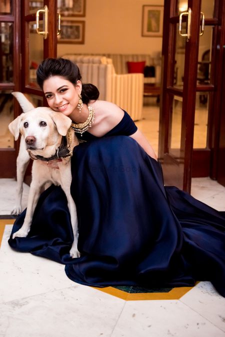 Photo of Bride with pet dog on sangeet
