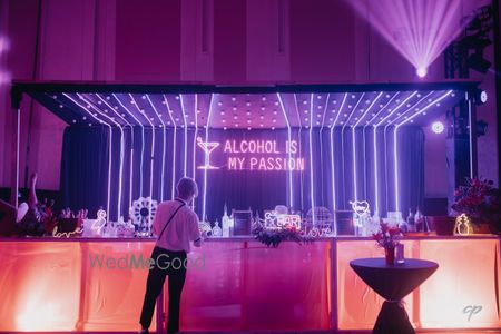 Photo of Fun bar set up with LED inspired lighting decor with personalised quotes