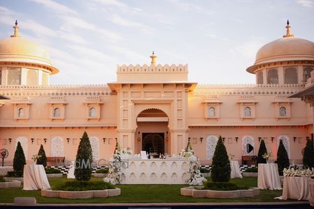 Photo of Stunning palace wedding venue with a lovely bar set up in an outdoor area