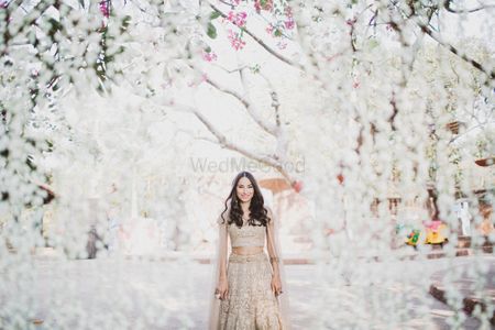 Bridal portrait with white floral backdrop