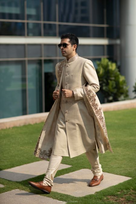 Photo of Groom look with beige sherwani and stole