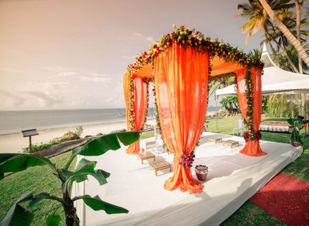 Photo of orange draped mandap