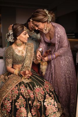 Photo of Bride with sister getting ready