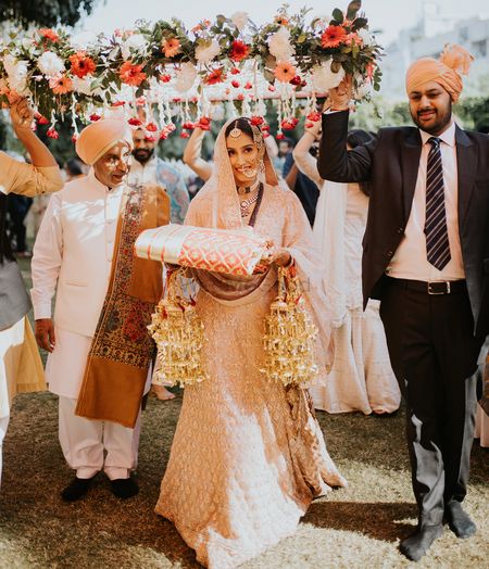 Bridal entry under phoolon ki chaadar