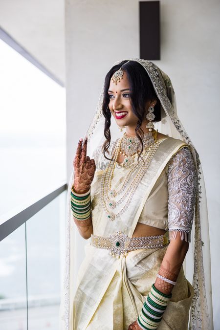 Bride in a silver kanjeevaram saree 
