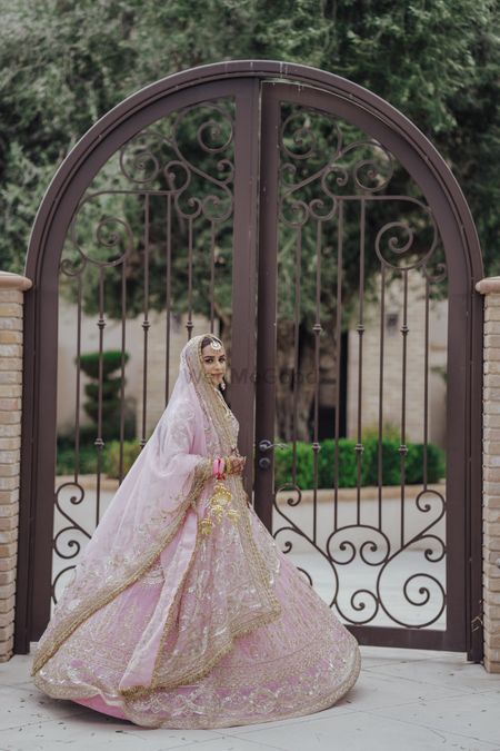 bride in pink manish malhotra lehenga