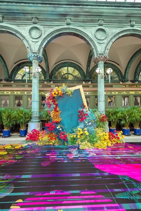 Photo of Unique floral decor with multi coloured flowers and printed floor