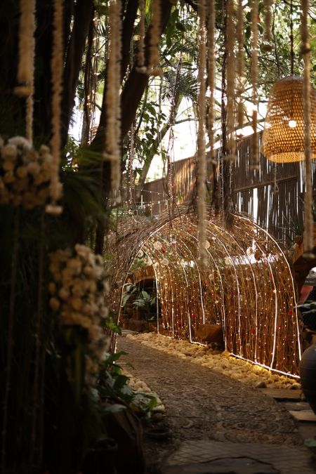 Beautiful tunnel style decor with rustic elements and lights