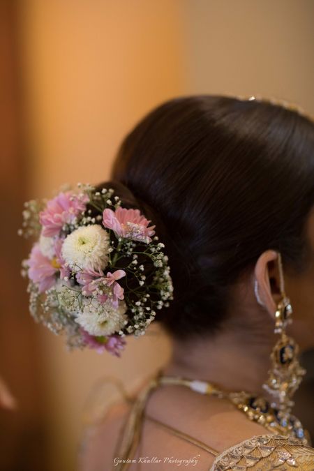 Bridal bun with small flowers and babys breath