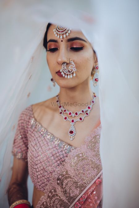 A bride wearing diamond jewellery on her wedding day 