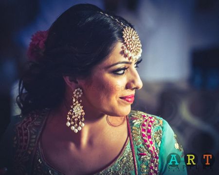 Bride in Turquoise Blouse and Polki Earrings