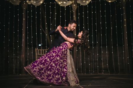 Candid shot of a dancing couple from their Sangeet.