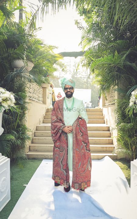Photo of Happy groom dressed in mint green sherwani