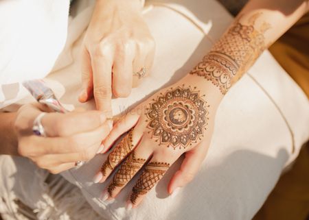Lovely mandala style bridal mehendi design for the back of the hand