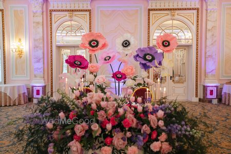 Beautiful oversized floral decor in mixed colours for in indoor mehendi event 