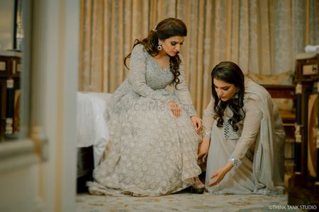 A friend helps the bride on her engagement day