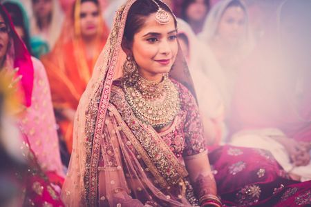 Gurudwara bride in maroon, sikh bride