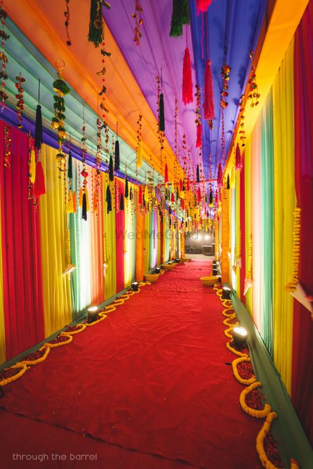 Photo of Colourful mehendi entrance decor