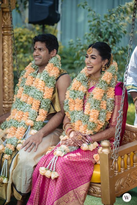 Photo of bride and groom in matching jaimalas